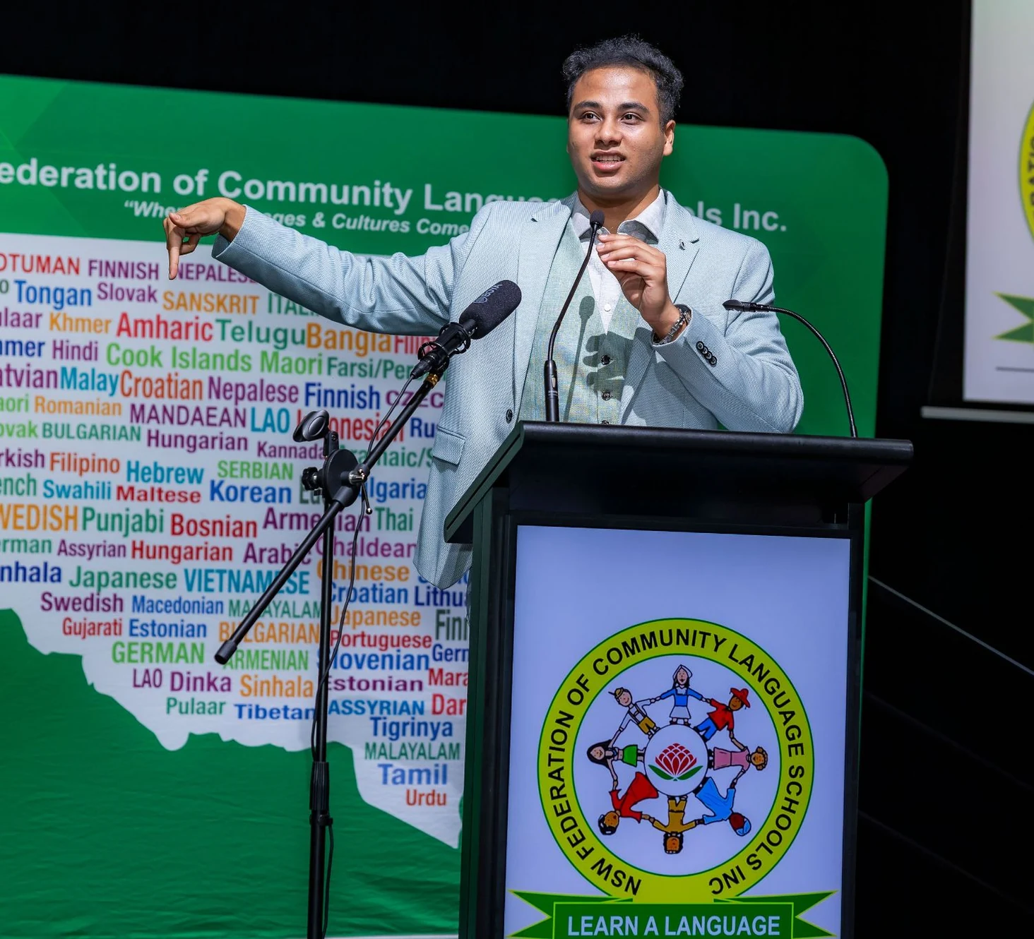 Nehal Nafcy accepting an award on stage